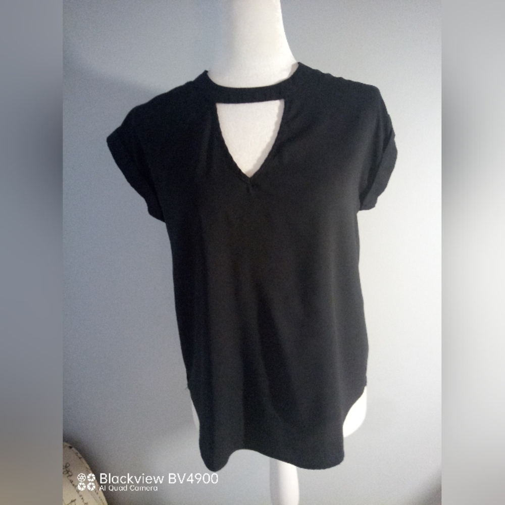 Vylette black sleeveless blouse. Size Small